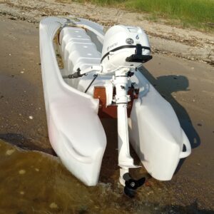 rear view of S4 Microskiff with 6 HP outboard motor