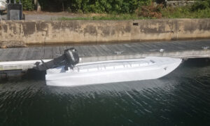 Wavewalk S4 in white with 8 HP Mercury outboard