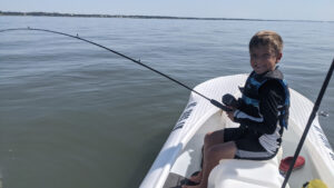 boy fishing out of S4 microskiff NC